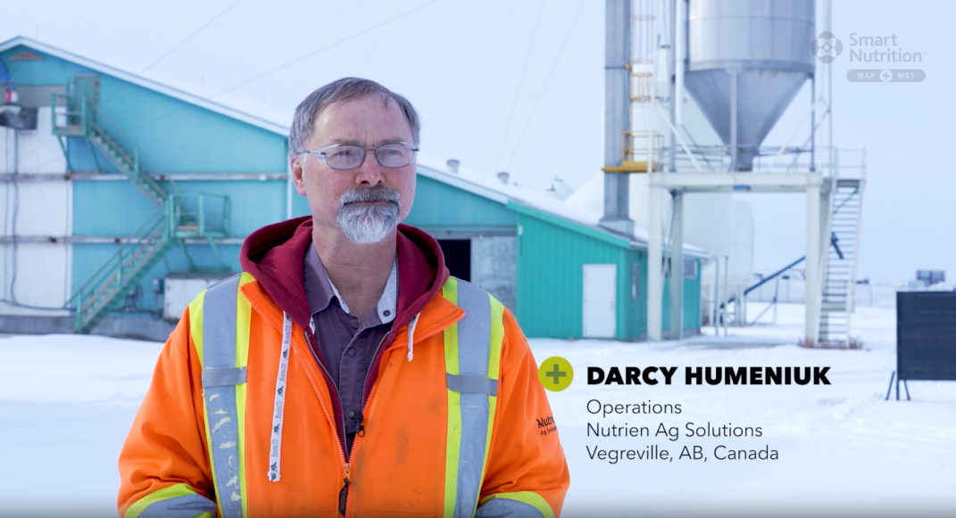 Darcy Humeniuk from the Operations team at Nutrien Ag Solutions photographed infront of a facility in Vegreville, Alberta Canada